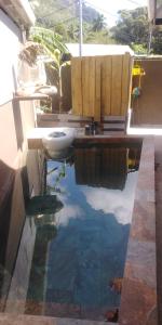 a bathroom with a tub and a sink in the water at Banian villa in Bora Bora
