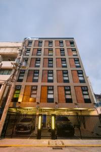 a tall building with a gate in front of it at Canopy Agutaya BGC in Manila
