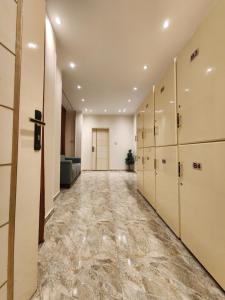 an empty hallway with lockers and a row of lockers at Hana Stay Hostel in Luxor