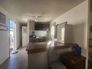 a kitchen with a counter top in a room at Depa Jardines Anahuac in Mexicali