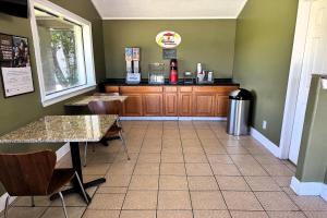 a fast food restaurant with a counter in a room at Super 8 by Wyndham Picayune in Picayune
