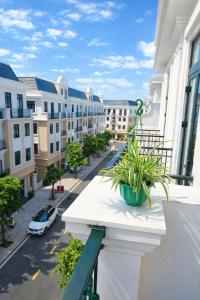 a balcony with a view of a street with buildings at Vinh Home Apartment in Quang Tri