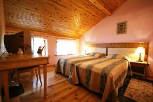 Tempat tidur dalam kamar di Vila Elvyra