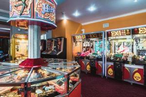 a bunch of pinball machines in a room at K&J's Caravan Rental in Kinmel Bay