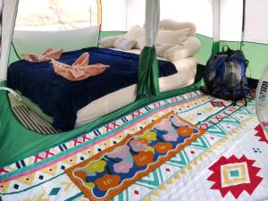 a birthday cake with a bed in a room at mist valley in Ban Nong Chaeng