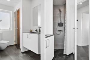 a white bathroom with a sink and a toilet at G331-Lemvig-Myntevej-31 in Lemvig +23 photos