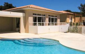 a house with a swimming pool in front of a house at Maison 1 in Montauroux +6 photos