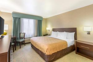 a hotel room with a bed and a desk at Quality Inn Payson I-15 in Payson +30 photos