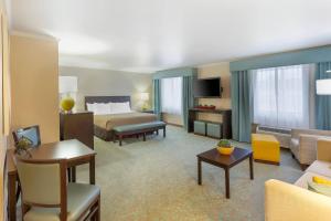 a hotel room with a bed and a couch at Quality Inn Payson I-15 in Payson