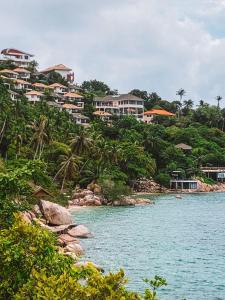 a view of a resort from the water at P.D. Beach Resort in Ko Tao