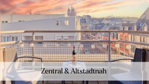 a view of a city from a balcony at Traumferienwohnung Domblick - Parkplatz inklusive, zentral mit Altstadtblick & Netflix in Limburg an der Lahn