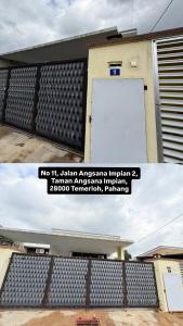 a sign on the side of a building at Eca's guest house in Temerloh