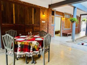 a dining room table with a tablecloth on it at Velora Villa Tangalle in Tangalle +33 photos