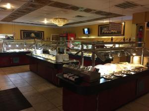 a restaurant with a buffet line with food at Dragon INN & Suites in Fayette