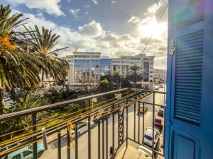 a view of a city from a balcony at Lafayette Central Apartment-Tunis in Tunis
