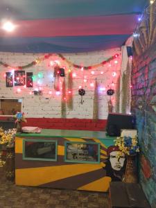 a room with a stage with lights and a counter at Paradise Homestay Tosh in Tosh