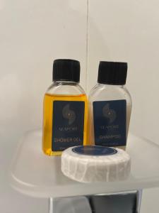 two bottles of soap sitting on a shelf at Seaport Negombo in Negombo