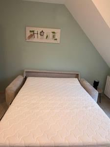 a bed in a room with a mattressvisor at Refuge idéal in Digoin