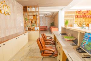 an office with a desk with chairs and a computer at Hotel Annapurna The Luxurious in Nalanda