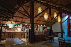 a large room with a bar and a restaurant at Ocean501 in Toamasina