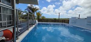 a view of a swimming pool from a house at ISLAND RESIDENCE Plaisance - Mauritius - Villa with Private Pool - 15718 in Plaine Magnien