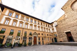 a large building with a large brick building at Lumi Stays in Florence