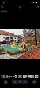 a view of a park with a playground at Edelweiss Central Hotel in Bansko