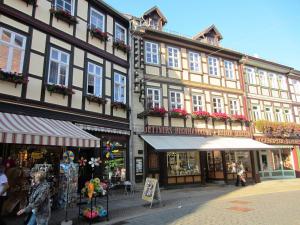 a group of buildings on a street with shops at Ferienhaus Wotan in Thale