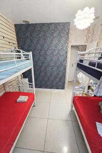 a room with two bunk beds and a wall at Korean Style Minbak Number Two PARIS in Paris