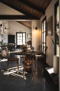 a dining room with a table and chairs at Auberge de la Roche in Valdeblore