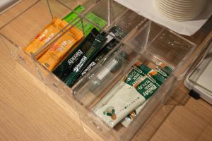 a plastic container withiazepines and otheriazepines on a table at Hostel STAND BY ME in Fukuoka