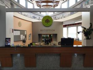 an office reception desk in an office building at 1A Landhotel Schicklberg in Kremsmünster +38 photos