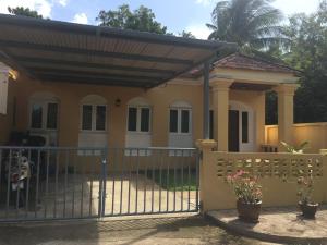 a house with a gate and a fence at Good Villa by Saran in Krabi