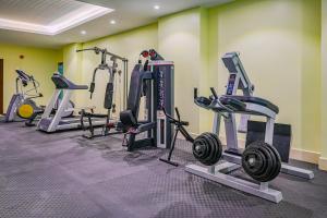 a gym with several tread machines in a room at فندق ترى النزهة -Tura Hotel AlNuzha in Riyadh