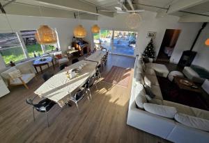 a living room with a table and a couch at vakantiehuis 't Loreem in Geraardsbergen +29 photos