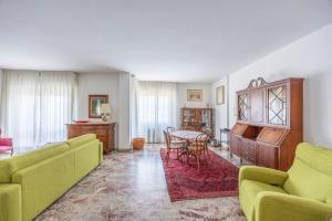 a living room with a couch and a table at Italian Experience-Mestrina Apartment in Mestre