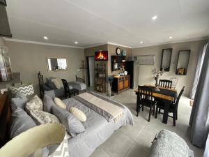 a bedroom with a bed and a desk in a room at ColtsRest in White River