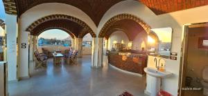 a bathroom with arches and a sink in a building at Habibi Nubian Guest House-Nubian Hospitality in Aswan