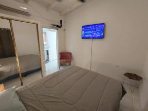 เตียงในห้องที่ Purple Peach Escapes +28 ภาพ