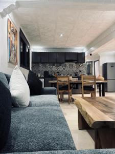 a living room with a couch and a table at Inass appartement in Essaouira