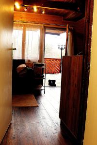 a living room with a bed and a window at Mókuslak Mátra in Mátraszentimre