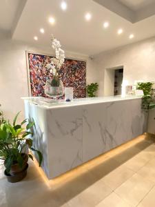 a lobby with a counter with a cake on it at Orto Di Roma in Rome