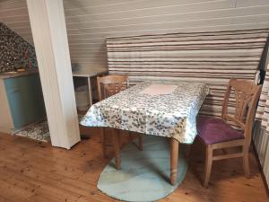 a table and chairs in a room with a table and a table and chairs at FeWo Aisch in Bad Windsheim +16 photos