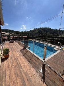 a swimming pool on the deck of a building at Refúgio Bosques de Itu in Itu