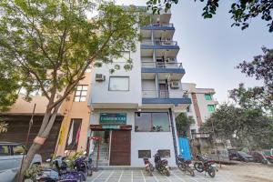 a building with motorcycles parked in front of it at Yashobhoomi Grand in Jāmb