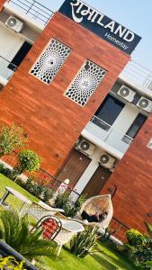 a building with a sign on the side of it at RamaLand A complete Stay in Faizābād