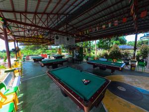 a group of ping pong tables in a pool hall at Banana Bar San Juan Family Digital Nomad Stay Starlink Fast WiFi Solar Backup in San Juan