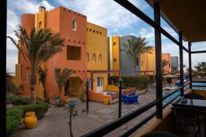 a view of a resort with a pool and palm trees at Al Dora Boutique Hotel in Hurghada