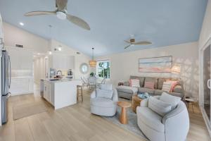 a living room with a couch and a kitchen at Captiva Hide A Way 2D in Captiva