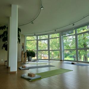 a large room with a yoga mat on the floor at Ringhotel VITALHOTEL ambiente in Bad Wilsnack